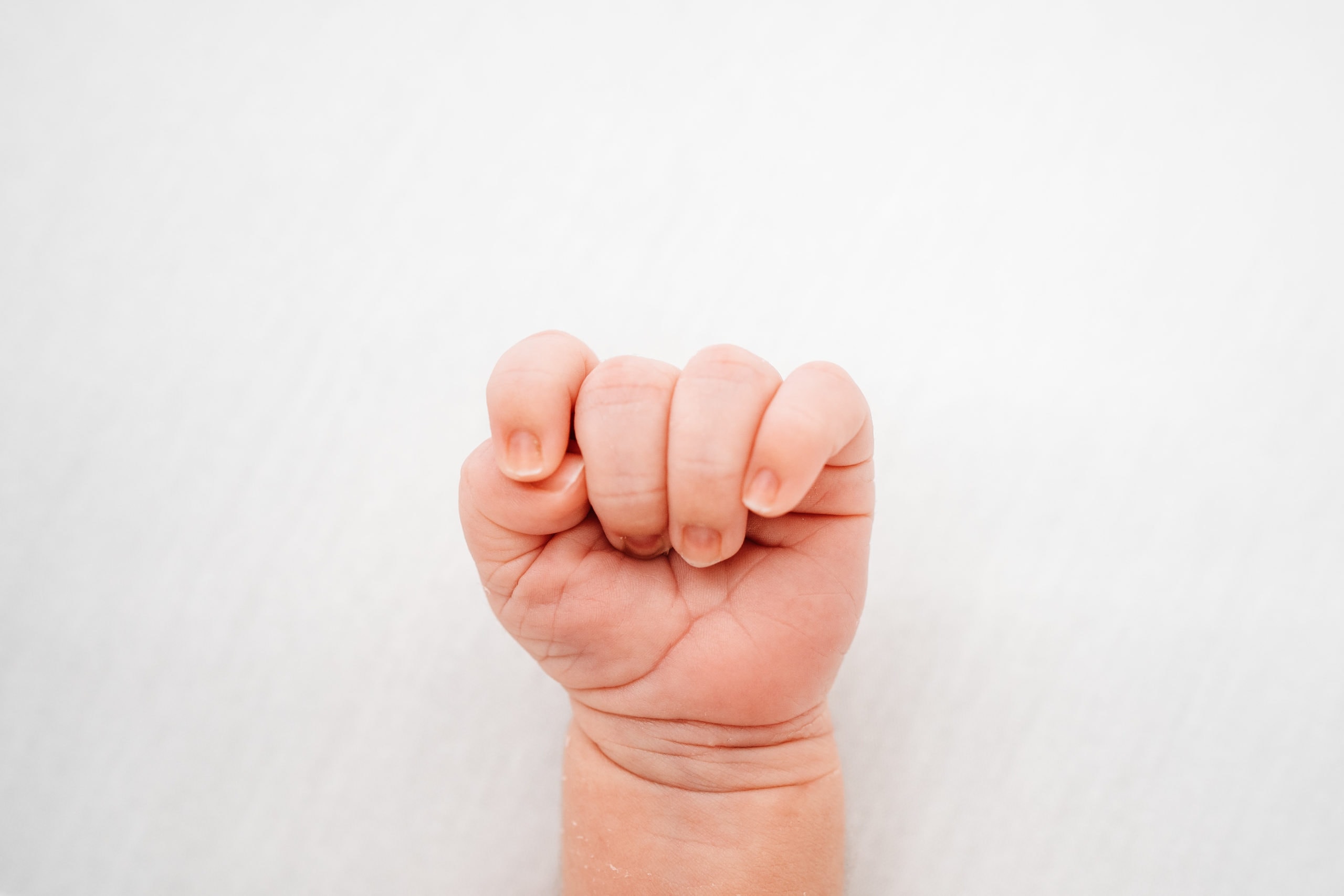close up of newborns closed fist taken during newborn photoshoot norwich